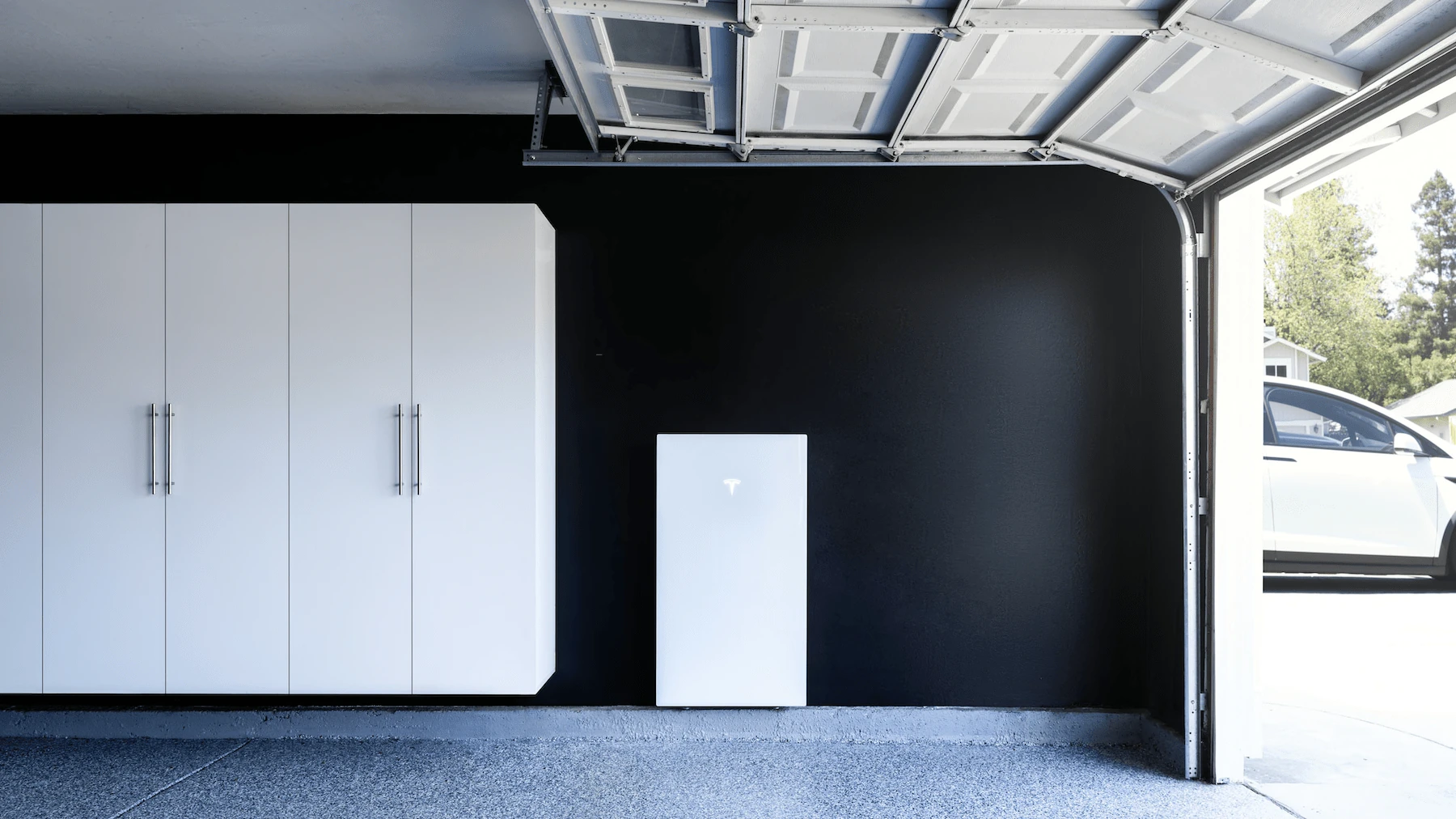 Tesla Powerwall battery in a garage